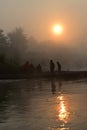Sun rising above the foggy river in Chitwan National Park in Nepal Royalty Free Stock Photo