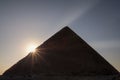 Sun rising behind the Great Pyramid