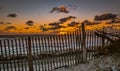 Sand Dune, Wind Fence and the Sunrise Royalty Free Stock Photo