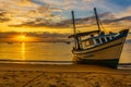 sun rising and lightening the boat Royalty Free Stock Photo