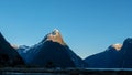 The sun rising on the summit of mitre peak in milford sound Royalty Free Stock Photo