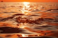 Sun\'s abstract orange hues dance on the water, creating stunning reflections