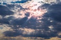 The sun`s rays breaking through the clouds, storm clouds at sea Royalty Free Stock Photo