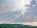 Sun`s rays bursting through the cloud onto the earth Royalty Free Stock Photo
