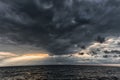 The sun's rays passing through the storm clouds over the sea. Close to Latvia, Liepaja Royalty Free Stock Photo