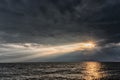 The sun`s rays passing through the storm clouds over the sea. Close to Liepaja. Latvia