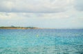 Sun`s rays Shine through the clouds over the turquoise sea on the beach of Palma de Mallorca, a tranquil scene with a copy of the Royalty Free Stock Photo