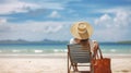 Sun, Sand, and Solitude - Young women traveler sitting on beach chair with straw bag for sunbathing on tropical island sand beach