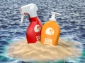 Sun screen lotion bottles in a sand of island and sea