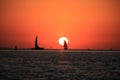 Sun set, boat and sailing Royalty Free Stock Photo