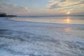 The sun set over the frozen lake