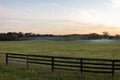 Sun set over ranch pasture with smoke