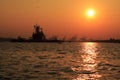 The sun set at the river , which have a ship on the background Royalty Free Stock Photo