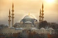 The sun sets above the Suleymaniye Mosque in Istanbul