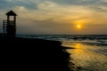 The sun sets at Kotu beach in The Gambia Royalty Free Stock Photo