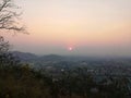 The sun sets on the mountains in the evening Royalty Free Stock Photo