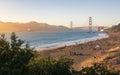 Sun sets near thr Golden Gate Bridge, Baker Beach