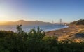 Sun sets near thr Golden Gate Bridge, Baker Beach