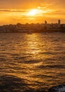 The sun sets over the Bosphorus, casting a golden glow on Istanbul's skyline Royalty Free Stock Photo