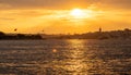 The sun sets over the Bosphorus, casting a golden glow on Istanbul's skyline Royalty Free Stock Photo