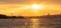 The sun sets over the Bosphorus, casting a golden glow on Istanbul's skyline Royalty Free Stock Photo