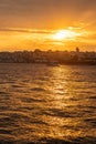 The sun sets over the Bosphorus, casting golden reflections on the water Royalty Free Stock Photo