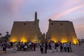 The sun sets over the entrance pylon of the Luxor Temple (Temple of Amun-Ra) in Luxor, Egypt.