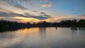 The sun sets over the mangrove forest and its reflection in the water of the lake Royalty Free Stock Photo