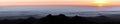 Sun Setting Above the Clouds via CA State Route 35 in Santa Cruz Mountains Royalty Free Stock Photo