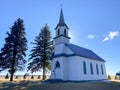 the sun begins to set on this longstanding historic old country church Royalty Free Stock Photo