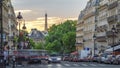 Sun setting behind a building on a Parisian Soufflot street timelapse with Eiffe tower on background Royalty Free Stock Photo