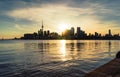 Sun setting behind Toronto`s downtown city skyline Royalty Free Stock Photo