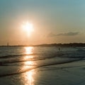 Sun setting on Cape May beach Royalty Free Stock Photo