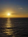 Sun setting on the horizon over the ocean just like a dream Royalty Free Stock Photo