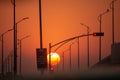 Sun setting in the middle of an empty street