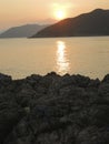 Sun Setting Over Coastal Rocks Royalty Free Stock Photo
