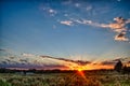 Sun setting over country farm land in york south carolina Royalty Free Stock Photo