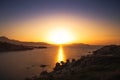 Sun setting over a Genoese tower and Calvi in Corsica Royalty Free Stock Photo