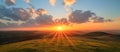 Sun Setting Over Grassy Hill Royalty Free Stock Photo