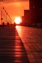 The sun setting over a long boardwalk - Long Beach New York