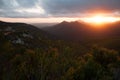 The sun setting over the mountain range of the Robinson pass. Royalty Free Stock Photo