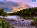 Sun Setting Over A Mountain By The Raritan River