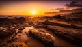 the sun is setting over the ocean on a beach with rocks and sand in the foreground and a rocky shoreline in the foreground. Royalty Free Stock Photo