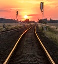 Sun is setting over the railroad tracks Royalty Free Stock Photo