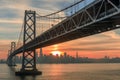 Sun setting over the western span of the Bay Bridge and San Francisco waterfront. Royalty Free Stock Photo