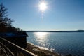 Sun shine at lake railing and hut Royalty Free Stock Photo