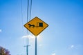 Sun shines from behind Amish traditional horse and buggy road sign in Lancaster County Pennsylvania, USA Royalty Free Stock Photo