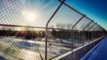 Sun shines brightly over highway bridge walking path Royalty Free Stock Photo