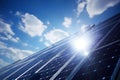 the sun shines brightly on a solar panel on a sunny day with clouds in the sky behind it and a blue sky with white clouds Royalty Free Stock Photo