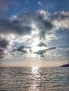 Sun shines through a calming sea Royalty Free Stock Photo